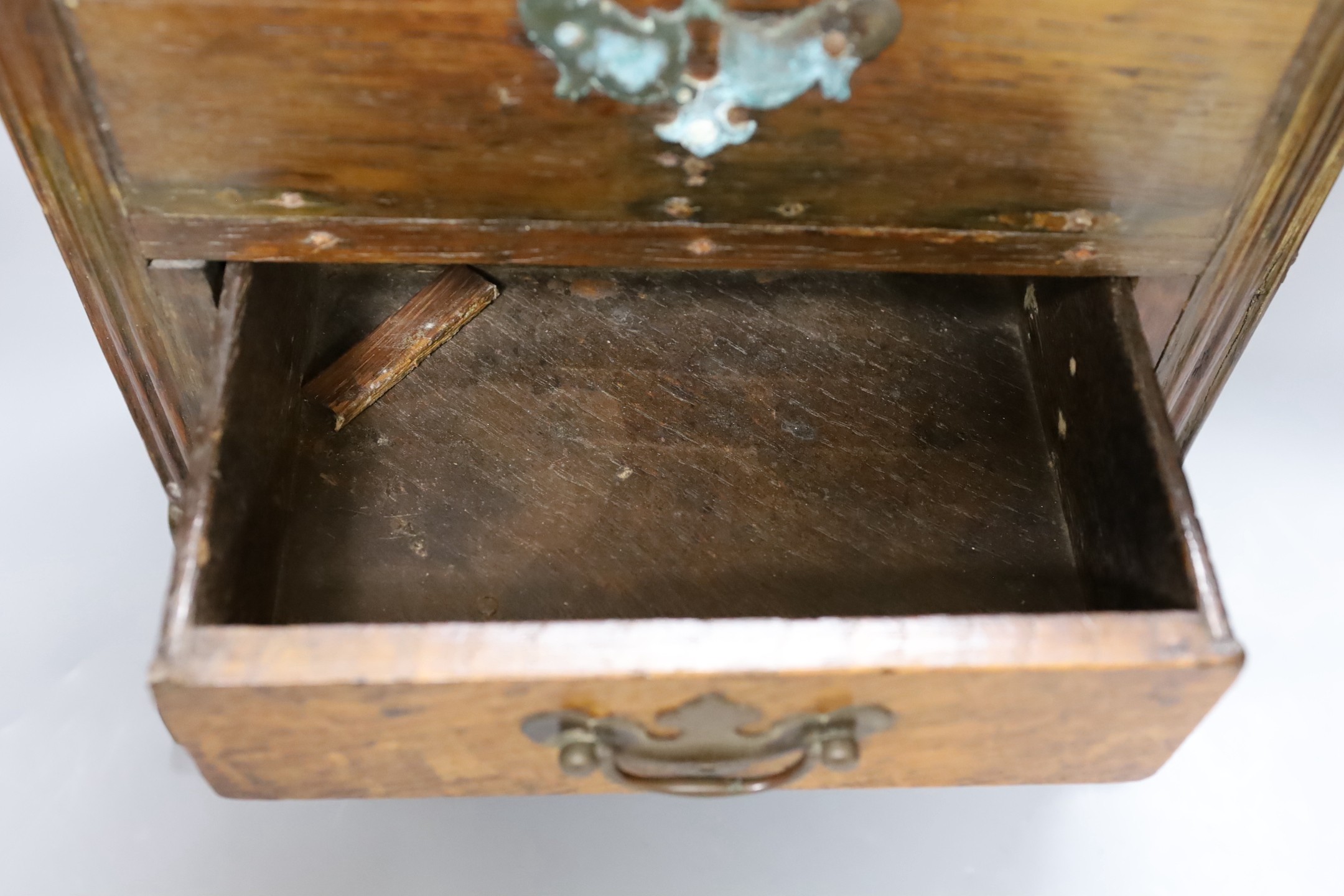 An 18th century and later oak spice cupboard, 53 cms high